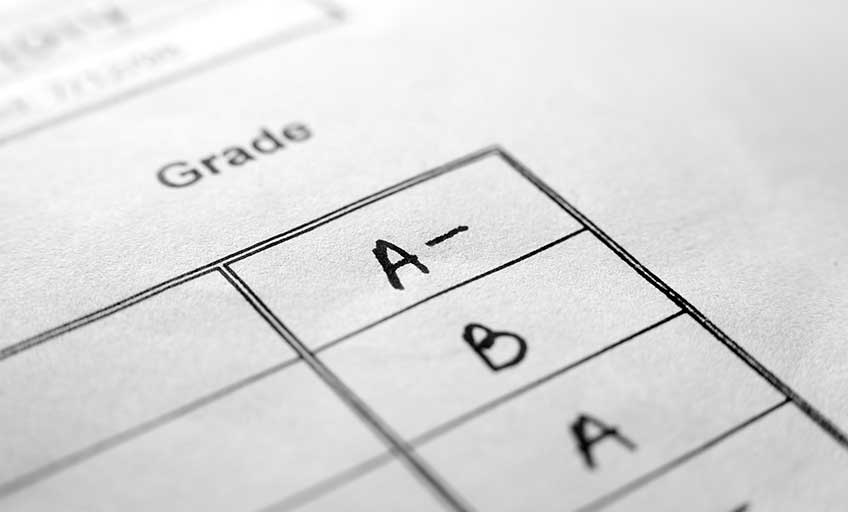 image shows a close-up of a report card