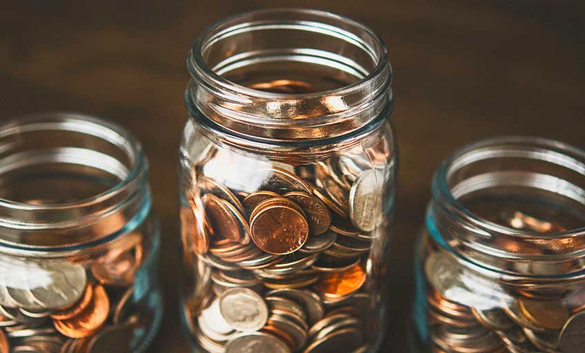 Coins in three bottles, related to retirement planning