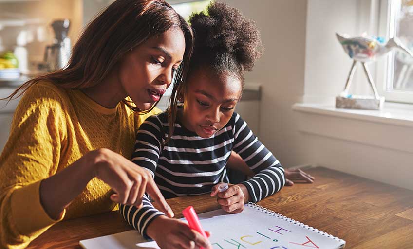 An image of a mother teaching her daughter
