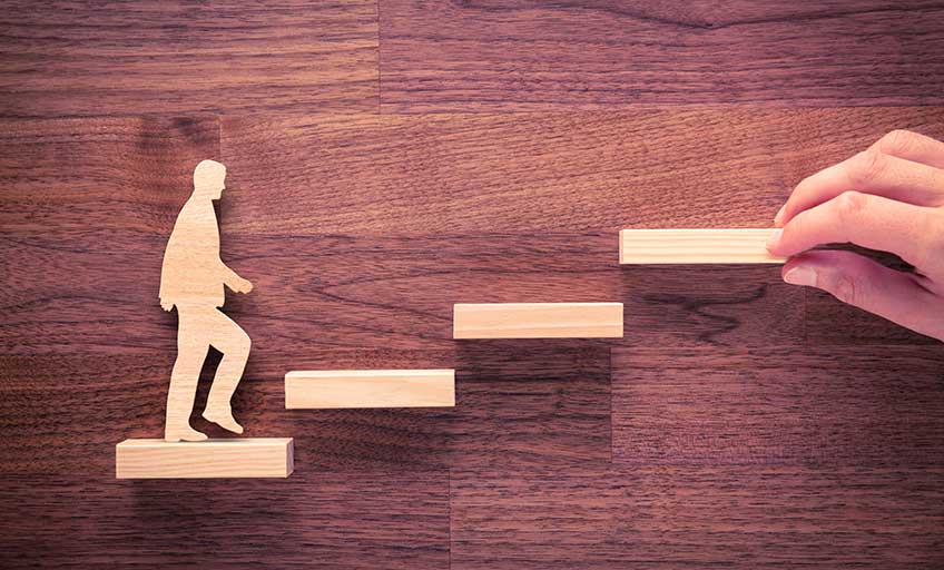 Image of a person walking up the steps