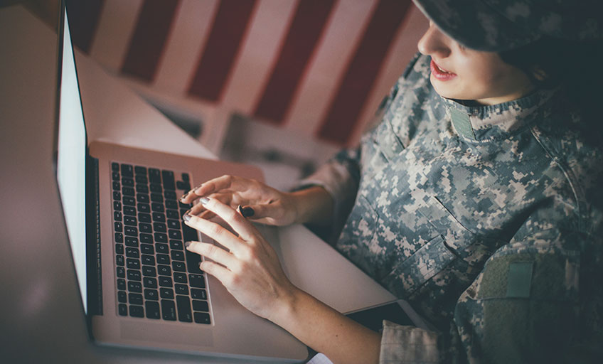 Person viewing VA income on laptop
