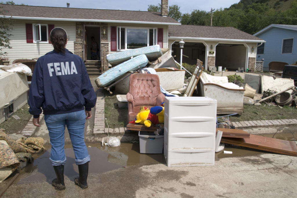 A woman reviewing FEMA flood