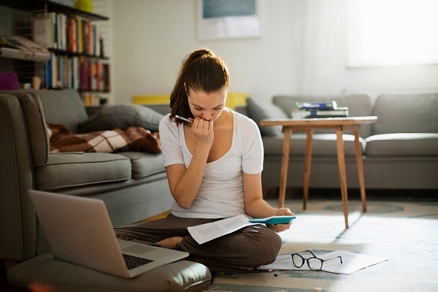Image of a woman doing calculations.